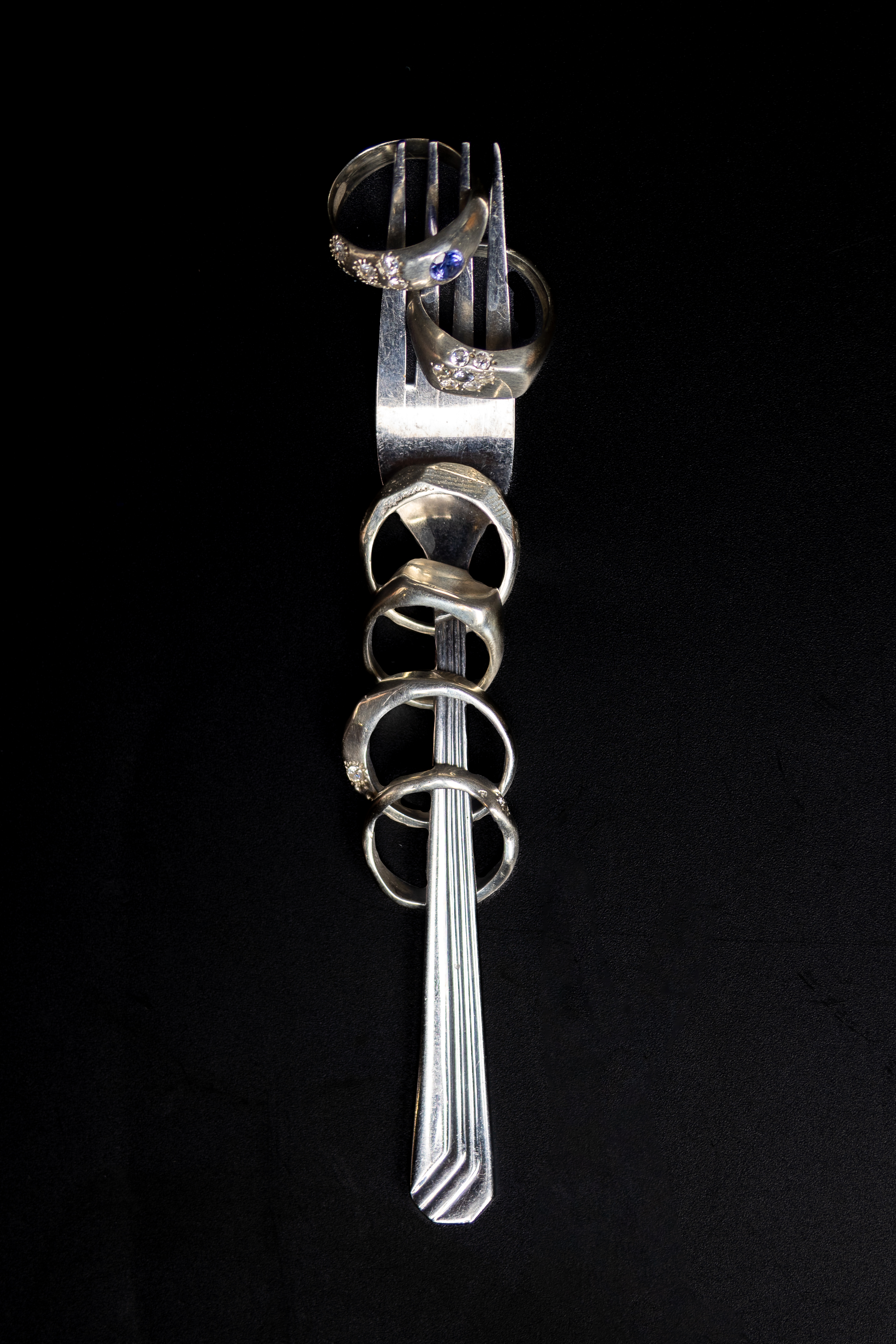 Tanzanite Bloom silver ring with oval tanzanite on black